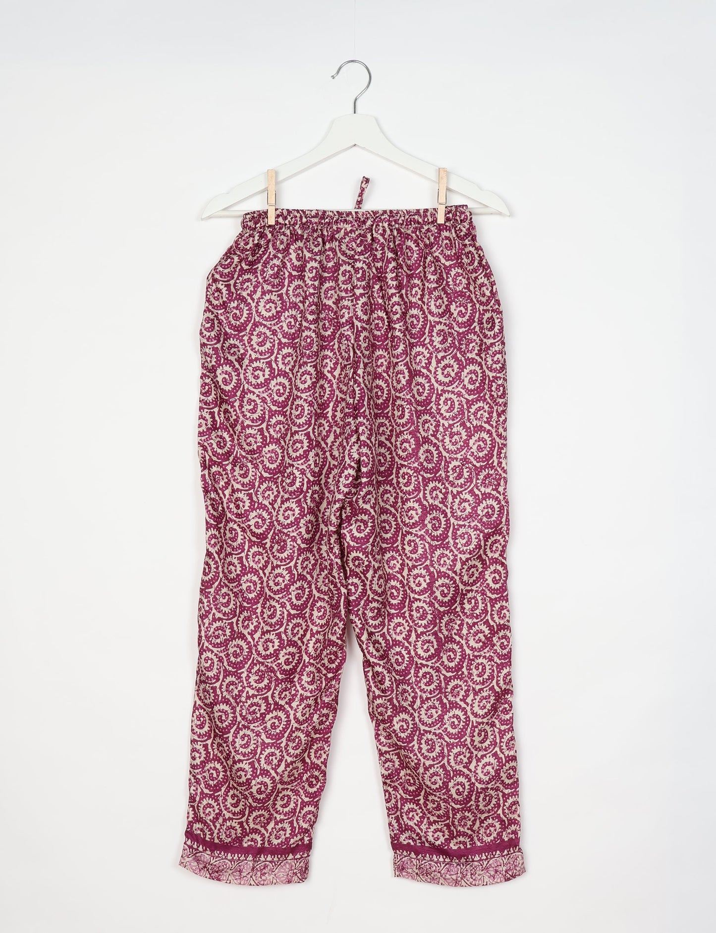 Elevate your wardrobe with our planet-friendly PULL-ON PANTS. Made from upcycled sari fabric, these eco-conscious pants offer a drawstring waist for a perfect fit. Tapered leg design ensures both style and comfort. Choose ethical, green fashion that supports artisans and sustainable living.