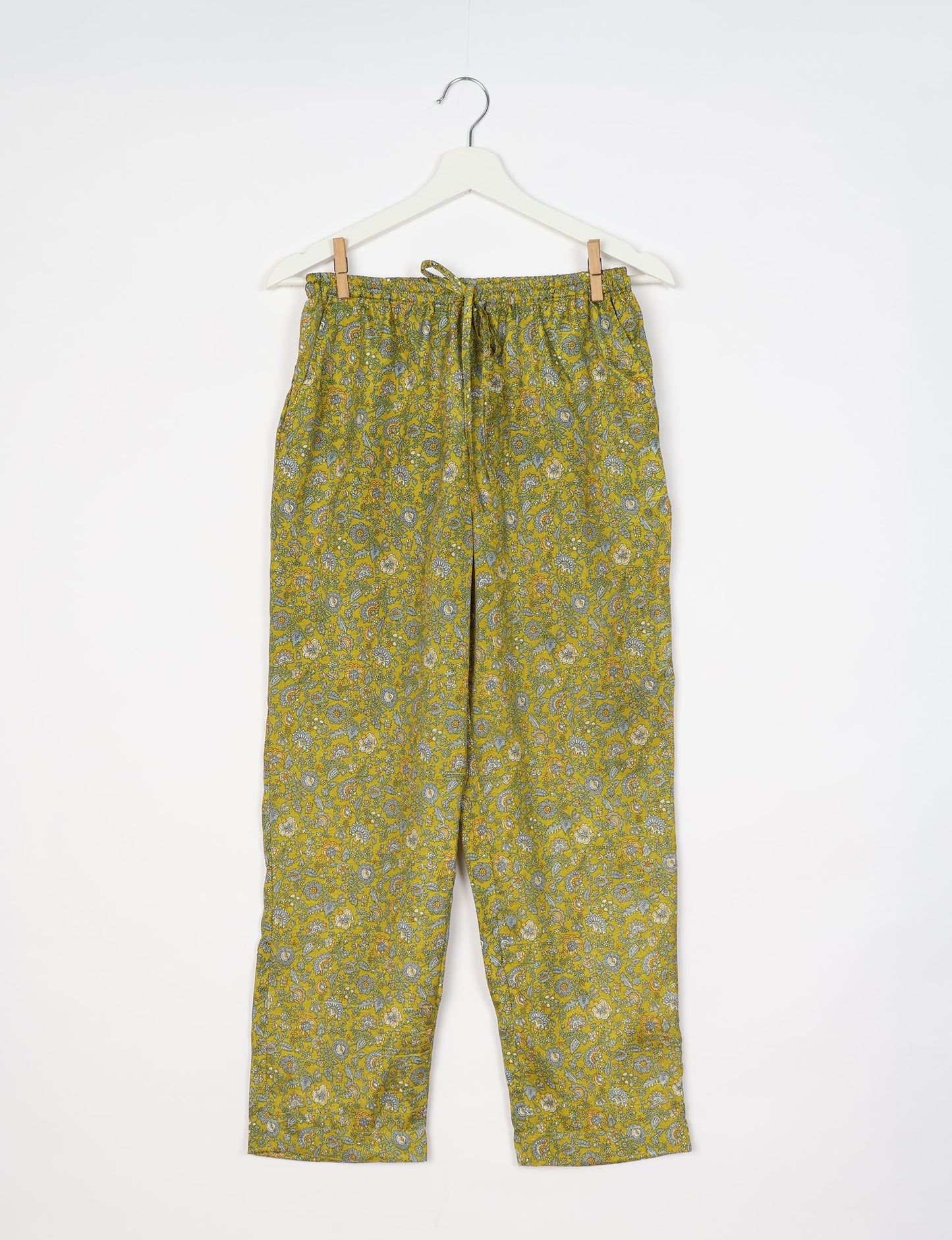 Elevate your wardrobe with our planet-friendly PULL-ON PANTS. Made from upcycled sari fabric, these eco-conscious pants offer a drawstring waist for a perfect fit. Tapered leg design ensures both style and comfort. Choose ethical, green fashion that supports artisans and sustainable living.