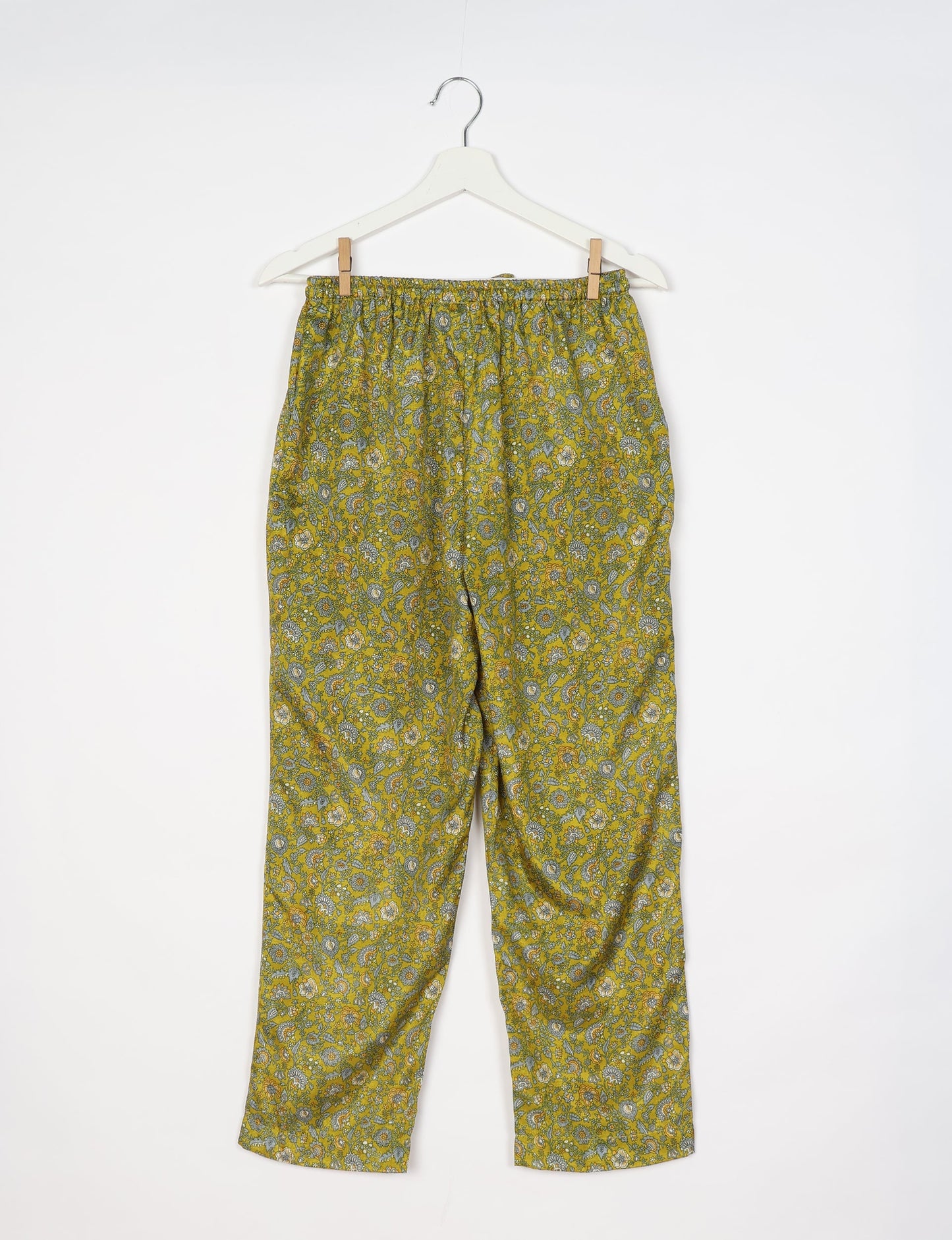 Elevate your wardrobe with our planet-friendly PULL-ON PANTS. Made from upcycled sari fabric, these eco-conscious pants offer a drawstring waist for a perfect fit. Tapered leg design ensures both style and comfort. Choose ethical, green fashion that supports artisans and sustainable living.
