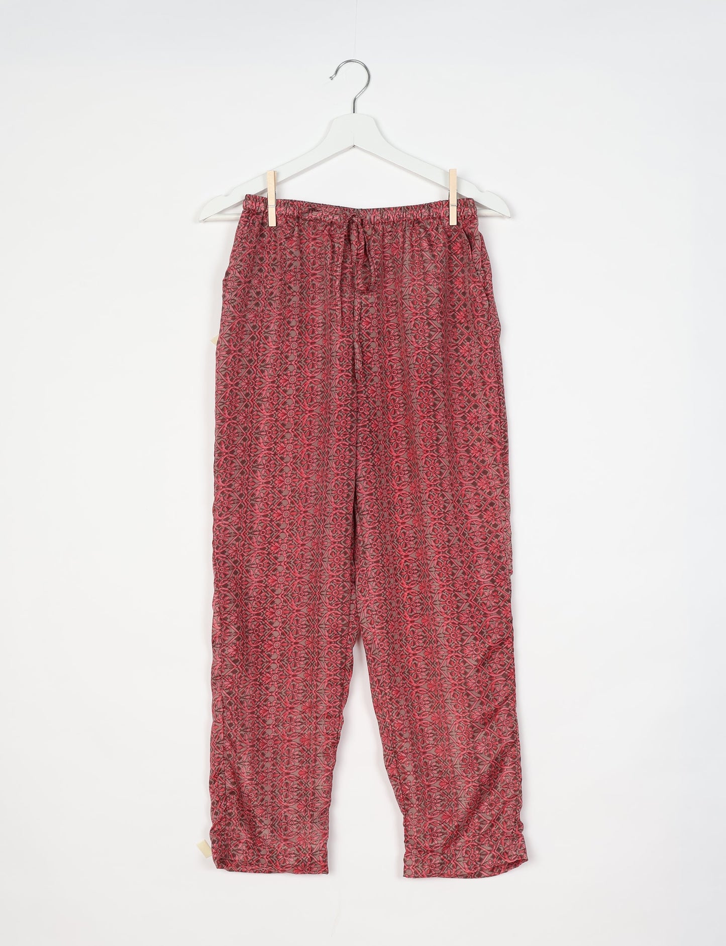 Elevate your wardrobe with our planet-friendly PULL-ON PANTS. Made from upcycled sari fabric, these eco-conscious pants offer a drawstring waist for a perfect fit. Tapered leg design ensures both style and comfort. Choose ethical, green fashion that supports artisans and sustainable living.