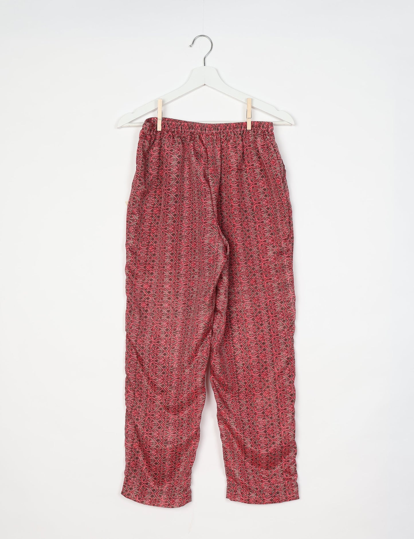 Elevate your wardrobe with our planet-friendly PULL-ON PANTS. Made from upcycled sari fabric, these eco-conscious pants offer a drawstring waist for a perfect fit. Tapered leg design ensures both style and comfort. Choose ethical, green fashion that supports artisans and sustainable living.