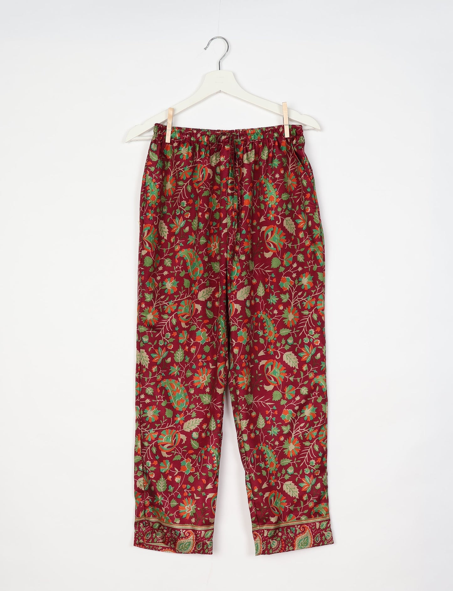 Elevate your wardrobe with our planet-friendly PULL-ON PANTS. Made from upcycled sari fabric, these eco-conscious pants offer a drawstring waist for a perfect fit. Tapered leg design ensures both style and comfort. Choose ethical, green fashion that supports artisans and sustainable living.