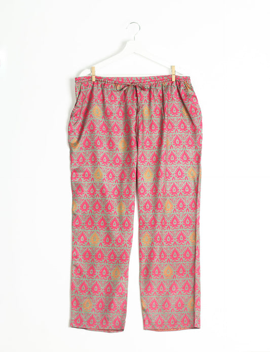 Elevate your wardrobe with our planet-friendly PULL-ON PANTS. Made from upcycled sari fabric, these eco-conscious pants offer a drawstring waist for a perfect fit. Tapered leg design ensures both style and comfort. Choose ethical, green fashion that supports artisans and sustainable living.