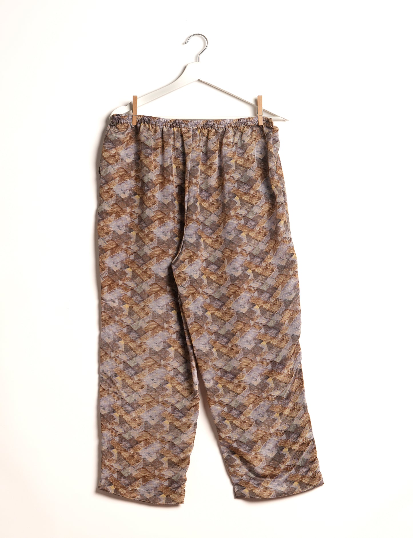 Elevate your wardrobe with our planet-friendly PULL-ON PANTS. Made from upcycled sari fabric, these eco-conscious pants offer a drawstring waist for a perfect fit. Tapered leg design ensures both style and comfort. Choose ethical, green fashion that supports artisans and sustainable living.