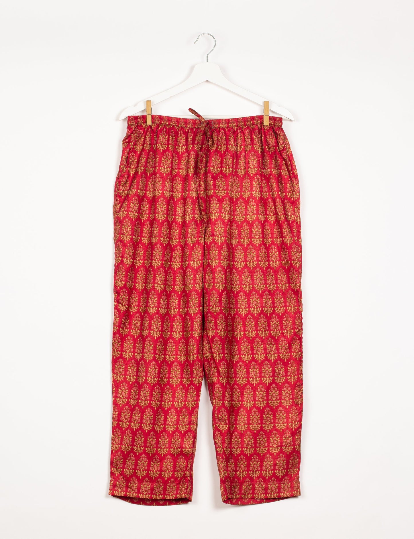 Elevate your wardrobe with our planet-friendly PULL-ON PANTS. Made from upcycled sari fabric, these eco-conscious pants offer a drawstring waist for a perfect fit. Tapered leg design ensures both style and comfort. Choose ethical, green fashion that supports artisans and sustainable living.