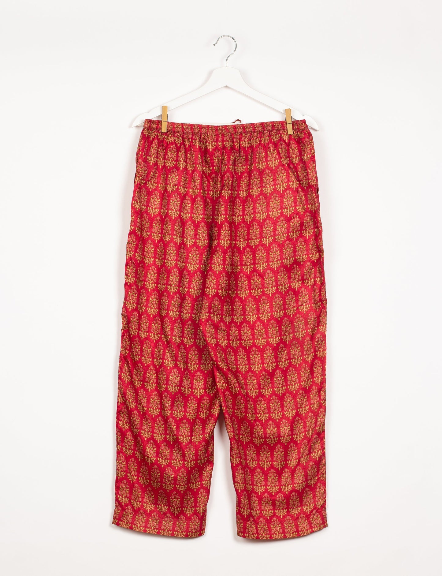 Elevate your wardrobe with our planet-friendly PULL-ON PANTS. Made from upcycled sari fabric, these eco-conscious pants offer a drawstring waist for a perfect fit. Tapered leg design ensures both style and comfort. Choose ethical, green fashion that supports artisans and sustainable living.