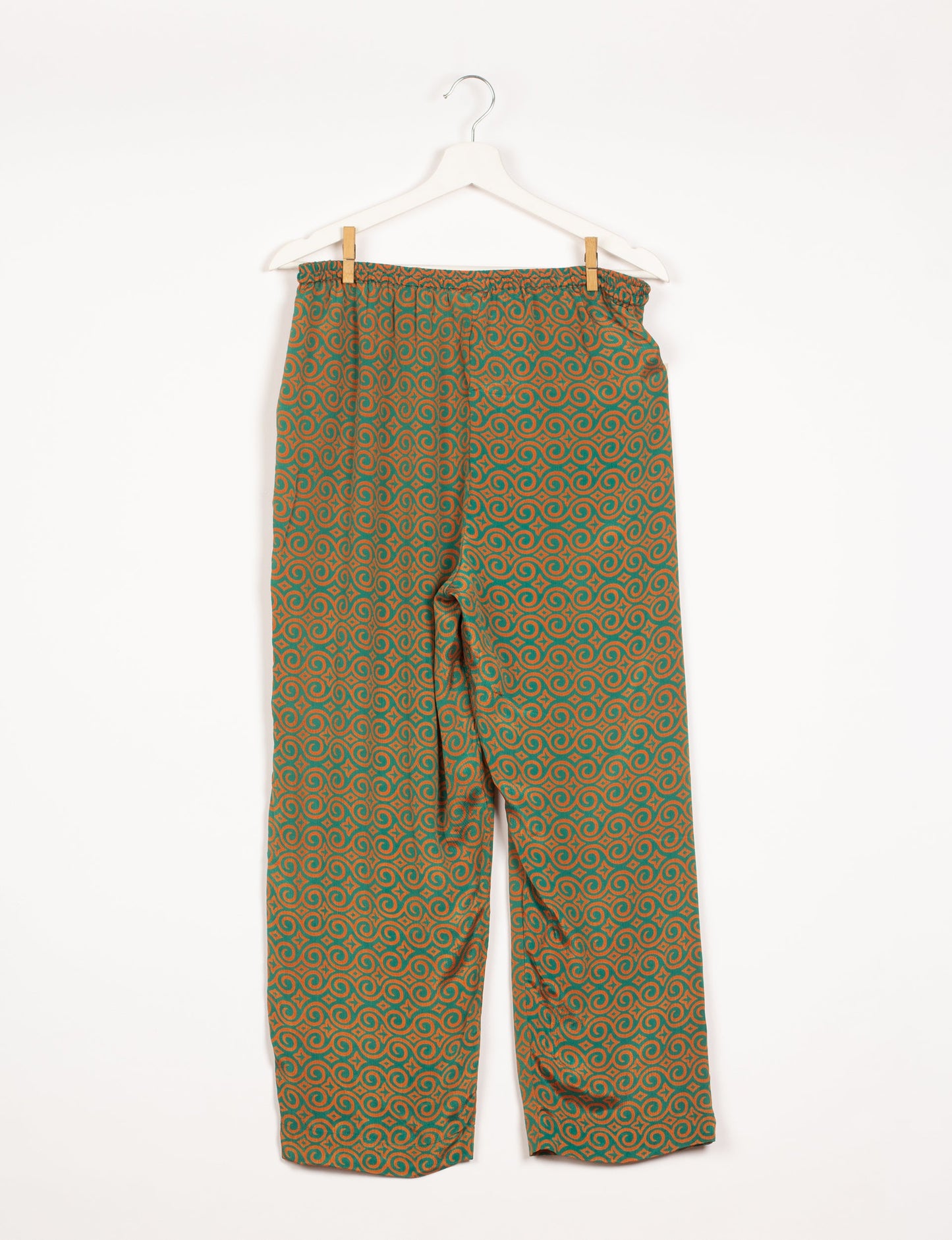 Elevate your wardrobe with our planet-friendly PULL-ON PANTS. Made from upcycled sari fabric, these eco-conscious pants offer a drawstring waist for a perfect fit. Tapered leg design ensures both style and comfort. Choose ethical, green fashion that supports artisans and sustainable living.