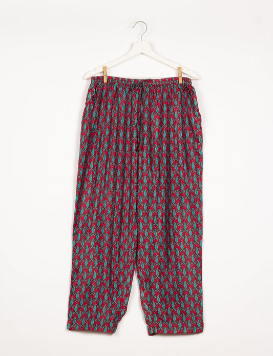 Elevate your wardrobe with our planet-friendly PULL-ON PANTS. Made from upcycled sari fabric, these eco-conscious pants offer a drawstring waist for a perfect fit. Tapered leg design ensures both style and comfort. Choose ethical, green fashion that supports artisans and sustainable living.