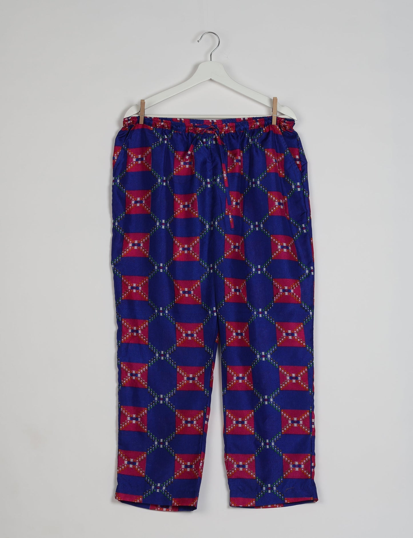 Elevate your wardrobe with our planet-friendly PULL-ON PANTS. Made from upcycled sari fabric, these eco-conscious pants offer a drawstring waist for a perfect fit. Tapered leg design ensures both style and comfort. Choose ethical, green fashion that supports artisans and sustainable living.