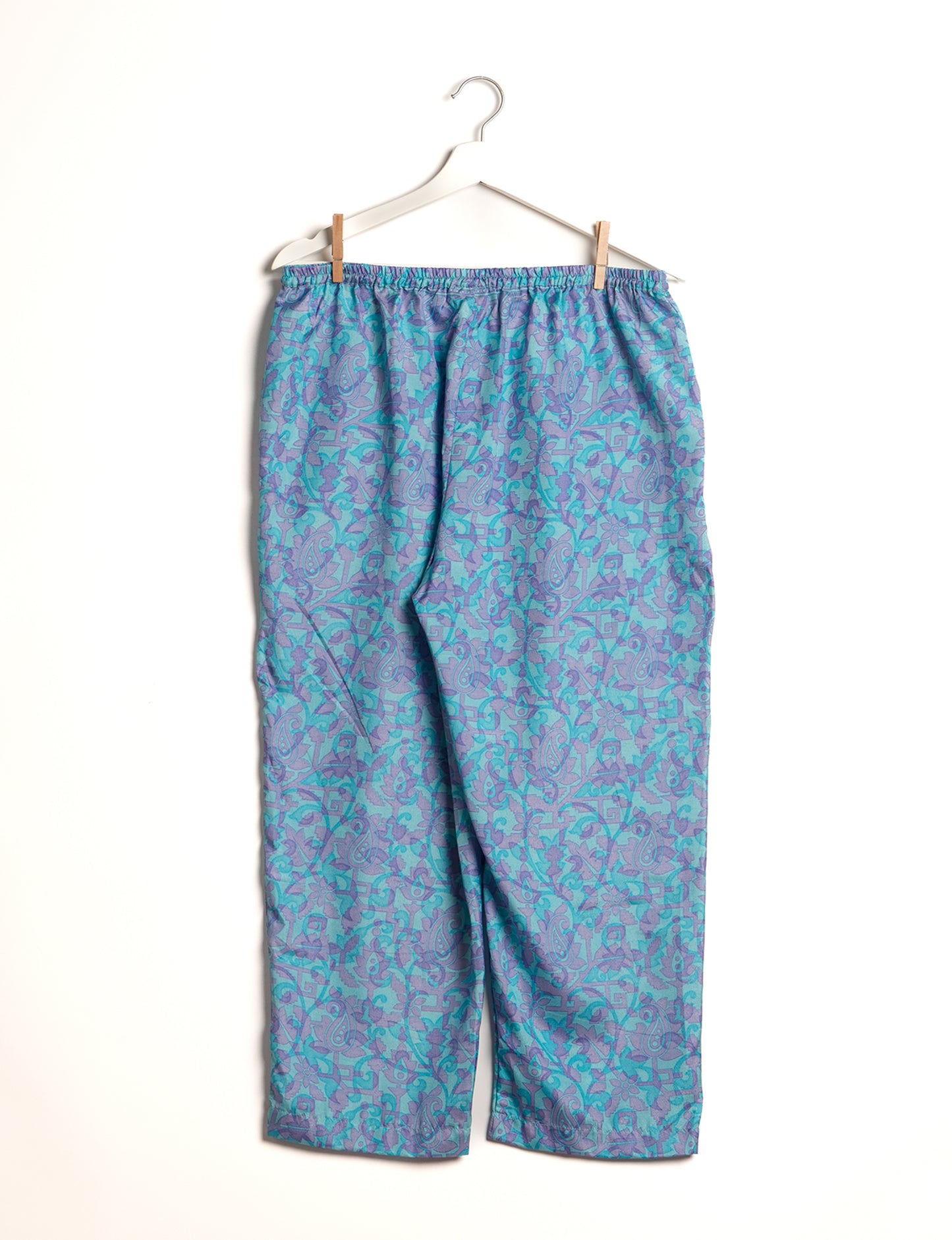 Elevate your wardrobe with our planet-friendly PULL-ON PANTS. Made from upcycled sari fabric, these eco-conscious pants offer a drawstring waist for a perfect fit. Tapered leg design ensures both style and comfort. Choose ethical, green fashion that supports artisans and sustainable living.