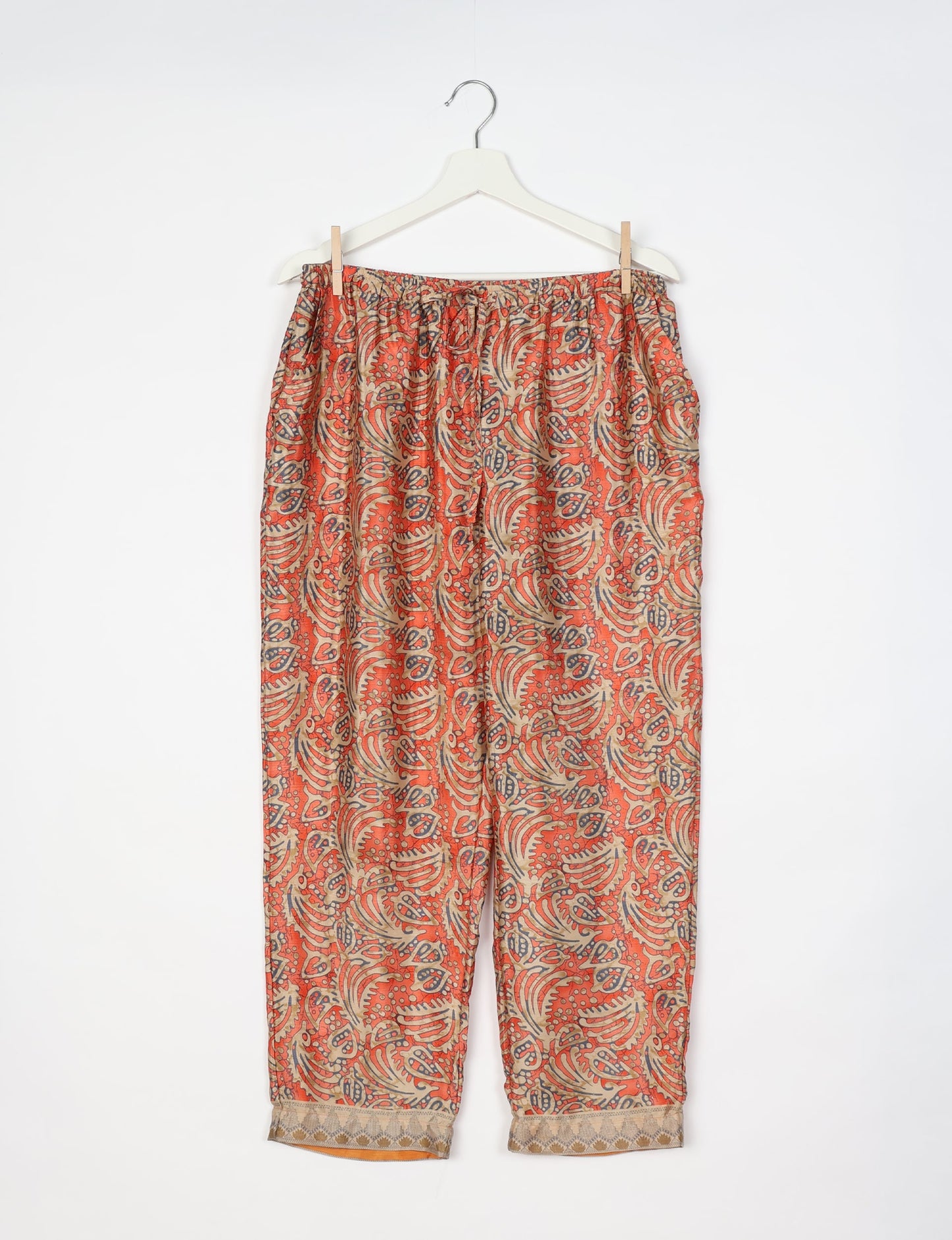 Elevate your wardrobe with our planet-friendly PULL-ON PANTS. Made from upcycled sari fabric, these eco-conscious pants offer a drawstring waist for a perfect fit. Tapered leg design ensures both style and comfort. Choose ethical, green fashion that supports artisans and sustainable living.