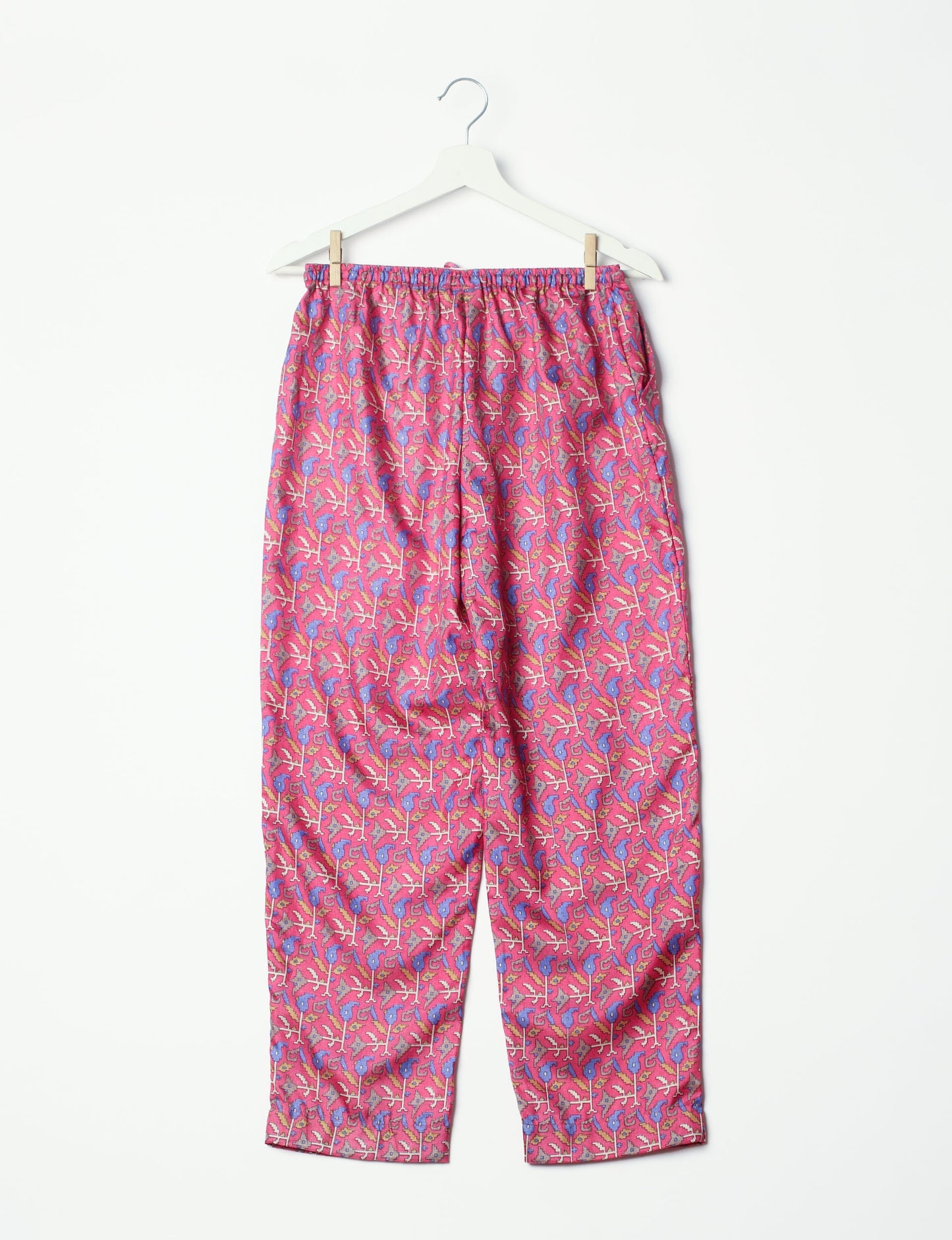 Elevate your wardrobe with our planet-friendly PULL-ON PANTS. Made from upcycled sari fabric, these eco-conscious pants offer a drawstring waist for a perfect fit. Tapered leg design ensures both style and comfort. Choose ethical, green fashion that supports artisans and sustainable living.