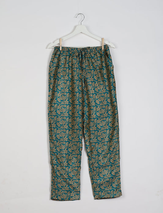 Elevate your wardrobe with our planet-friendly PULL-ON PANTS. Made from upcycled sari fabric, these eco-conscious pants offer a drawstring waist for a perfect fit. Tapered leg design ensures both style and comfort. Choose ethical, green fashion that supports artisans and sustainable living.