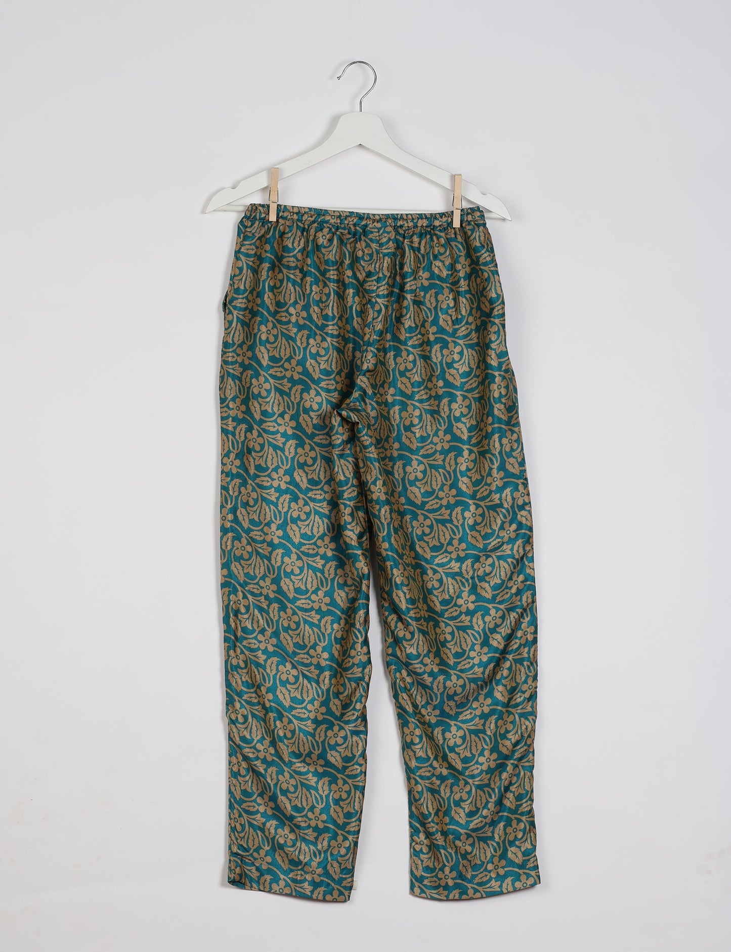 Elevate your wardrobe with our planet-friendly PULL-ON PANTS. Made from upcycled sari fabric, these eco-conscious pants offer a drawstring waist for a perfect fit. Tapered leg design ensures both style and comfort. Choose ethical, green fashion that supports artisans and sustainable living.