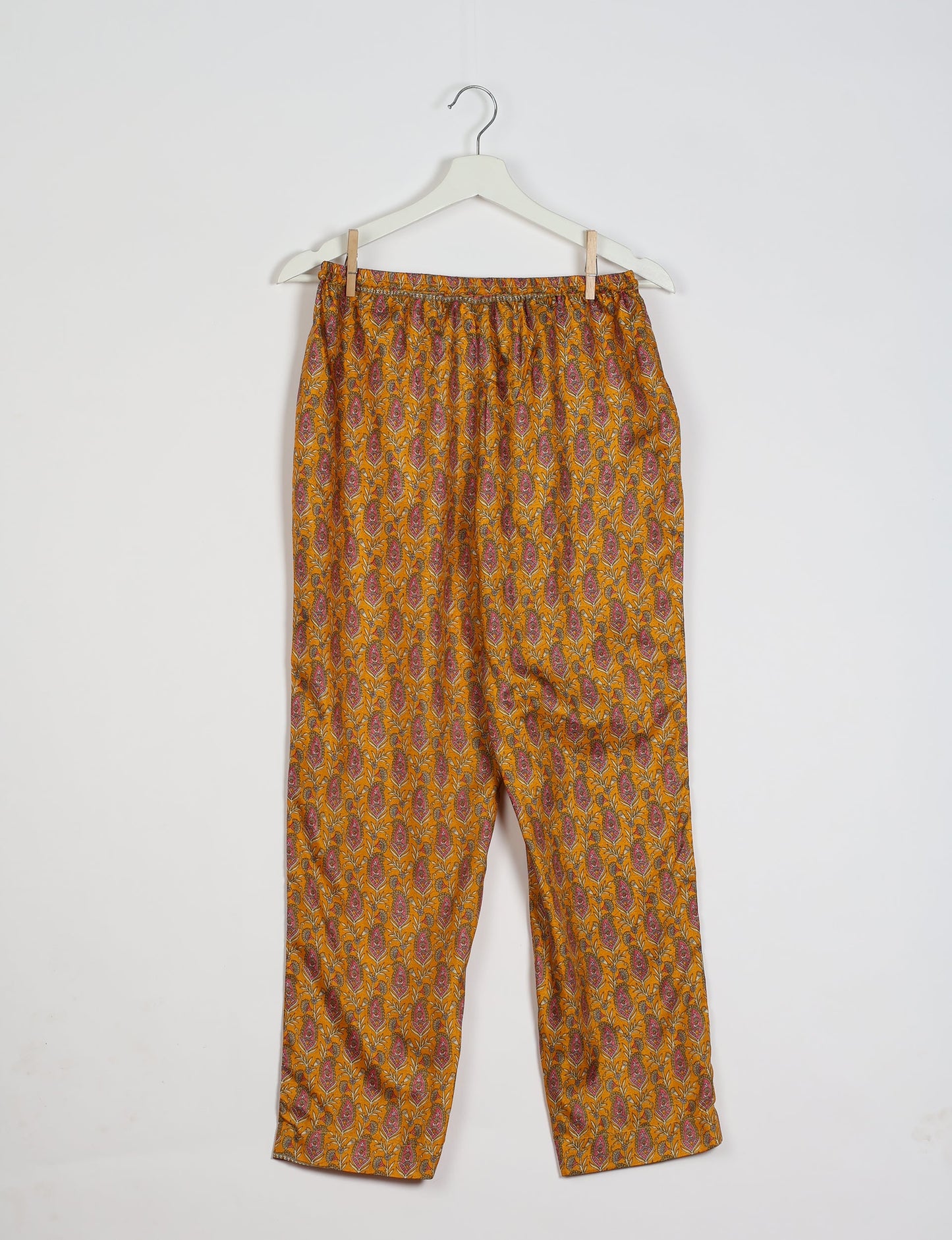 Elevate your wardrobe with our planet-friendly PULL-ON PANTS. Made from upcycled sari fabric, these eco-conscious pants offer a drawstring waist for a perfect fit. Tapered leg design ensures both style and comfort. Choose ethical, green fashion that supports artisans and sustainable living.