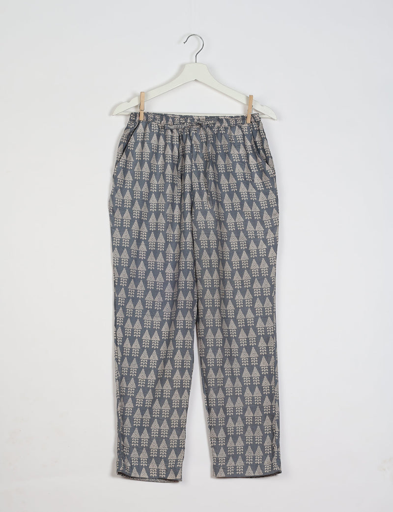 Grey pull-on pants with beige geometric pattern, elastic waistband, and side pockets, hanging on white hanger