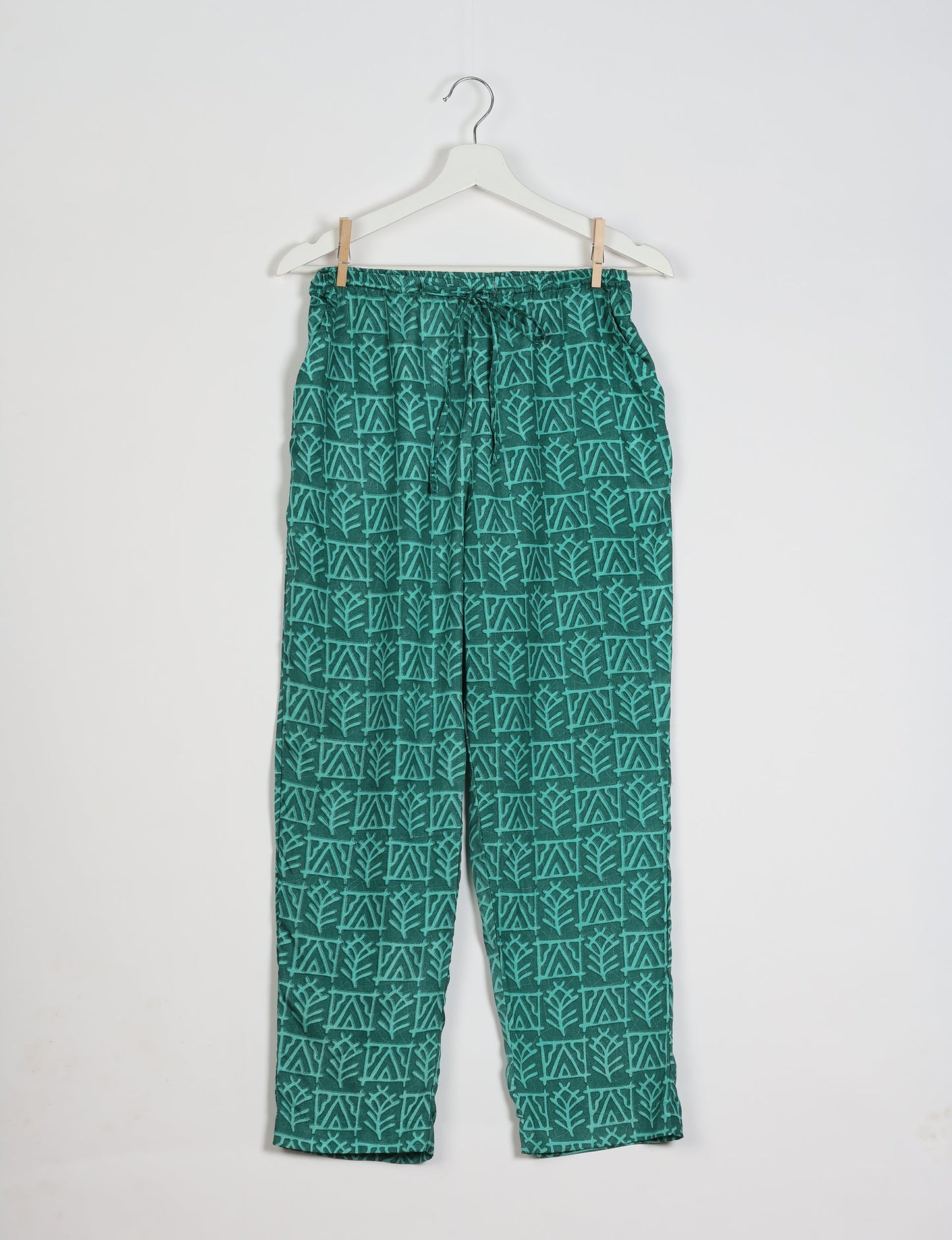 Elevate your wardrobe with our planet-friendly PULL-ON PANTS. Made from upcycled sari fabric, these eco-conscious pants offer a drawstring waist for a perfect fit. Tapered leg design ensures both style and comfort. Choose ethical, green fashion that supports artisans and sustainable living.