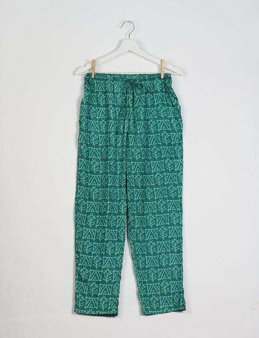 Elevate your wardrobe with our planet-friendly PULL-ON PANTS. Made from upcycled sari fabric, these eco-conscious pants offer a drawstring waist for a perfect fit. Tapered leg design ensures both style and comfort. Choose ethical, green fashion that supports artisans and sustainable living.