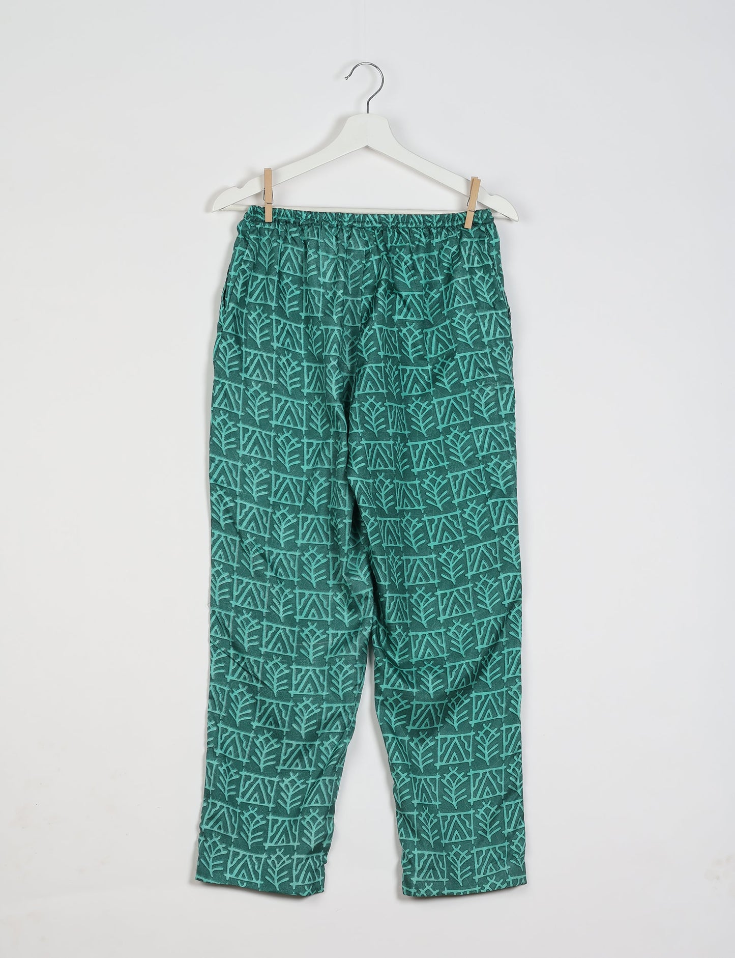 Elevate your wardrobe with our planet-friendly PULL-ON PANTS. Made from upcycled sari fabric, these eco-conscious pants offer a drawstring waist for a perfect fit. Tapered leg design ensures both style and comfort. Choose ethical, green fashion that supports artisans and sustainable living.