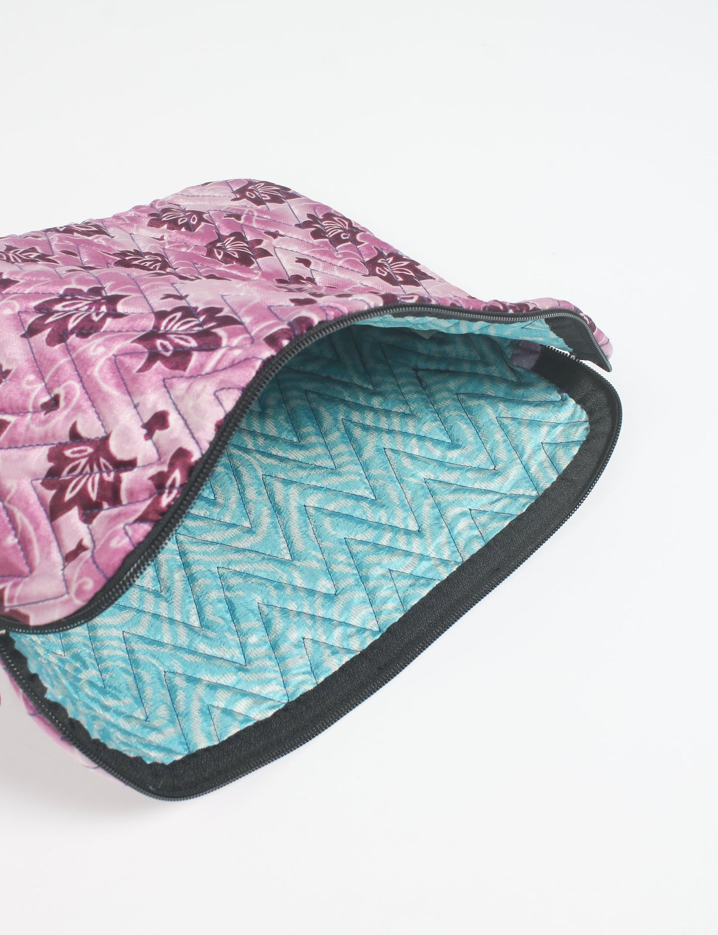 Eco-friendly meets tech-savvy in our QUILTED LAPTOP SLEEVE 13-14 inches. Stylishly quilted for durability, this sleeve offers protection and ethical fashion for your 13"-14" laptop. Secure your device with the zippered closure and carry it sustainably wherever you go.