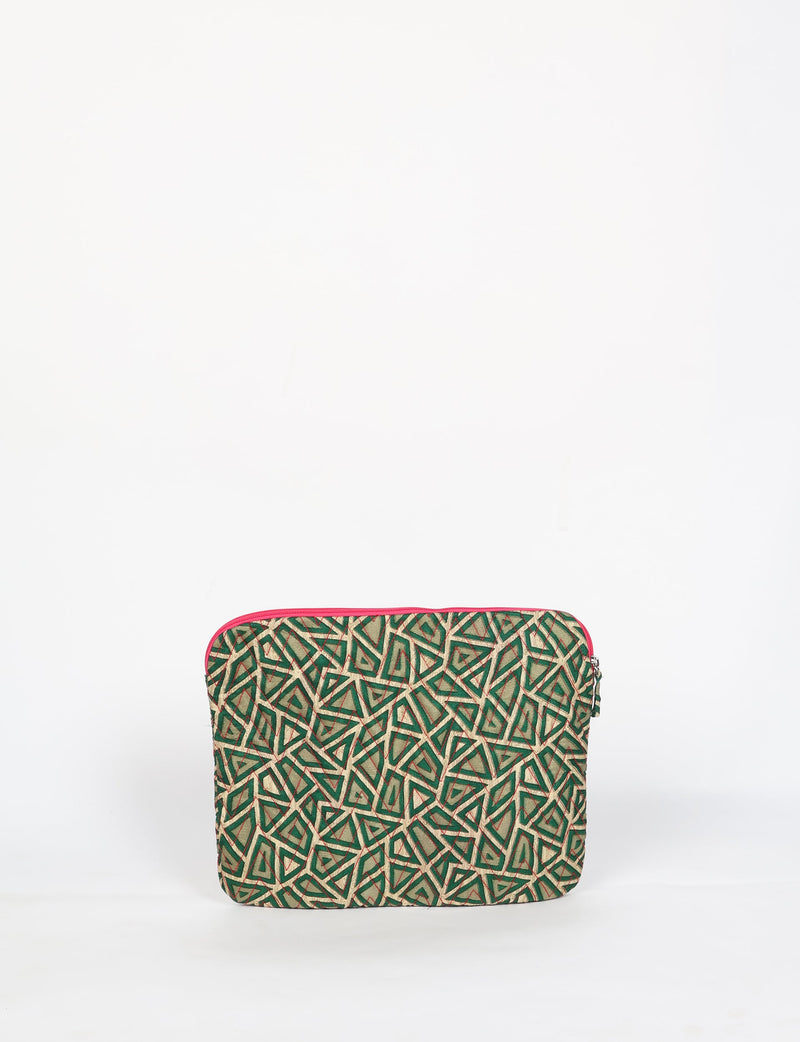 Quilted laptop sleeve with green paisley geometric pattern and red zipper, front view, standing upright on white background