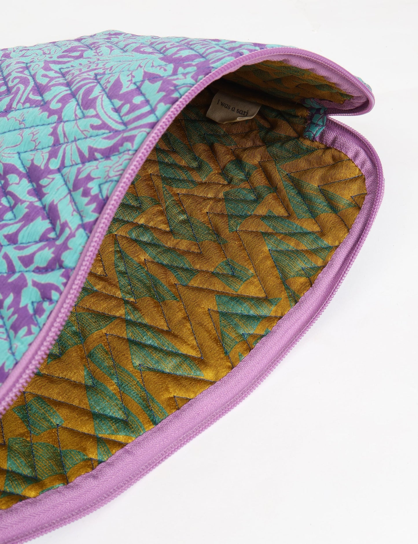 Eco-friendly meets tech-savvy in our QUILTED LAPTOP SLEEVE 13-14 inches. Stylishly quilted for durability, this sleeve offers protection and ethical fashion for your 13"-14" laptop. Secure your device with the zippered closure and carry it sustainably wherever you go.