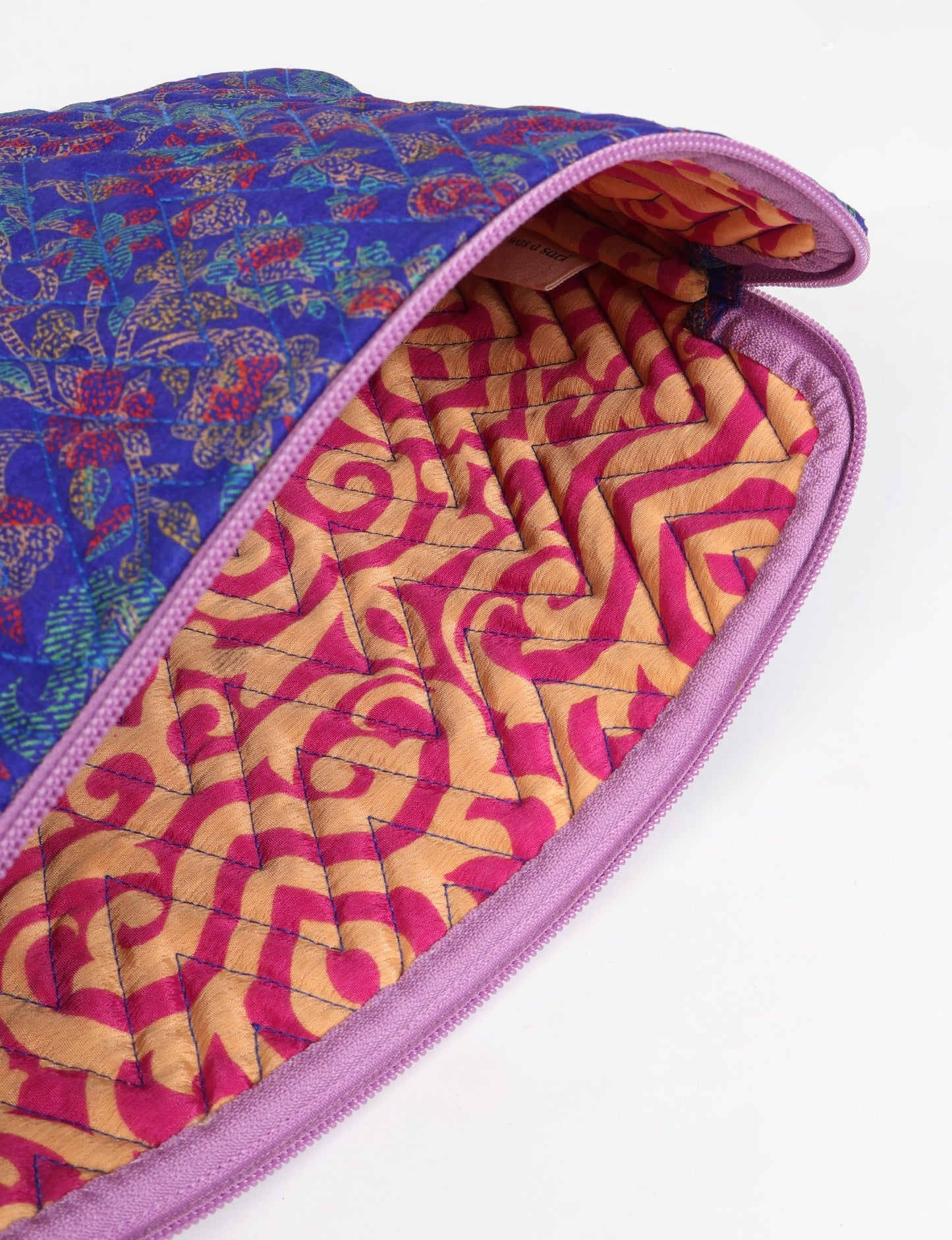 Eco-friendly meets tech-savvy in our QUILTED LAPTOP SLEEVE 13-14 inches. Stylishly quilted for durability, this sleeve offers protection and ethical fashion for your 13"-14" laptop. Secure your device with the zippered closure and carry it sustainably wherever you go.