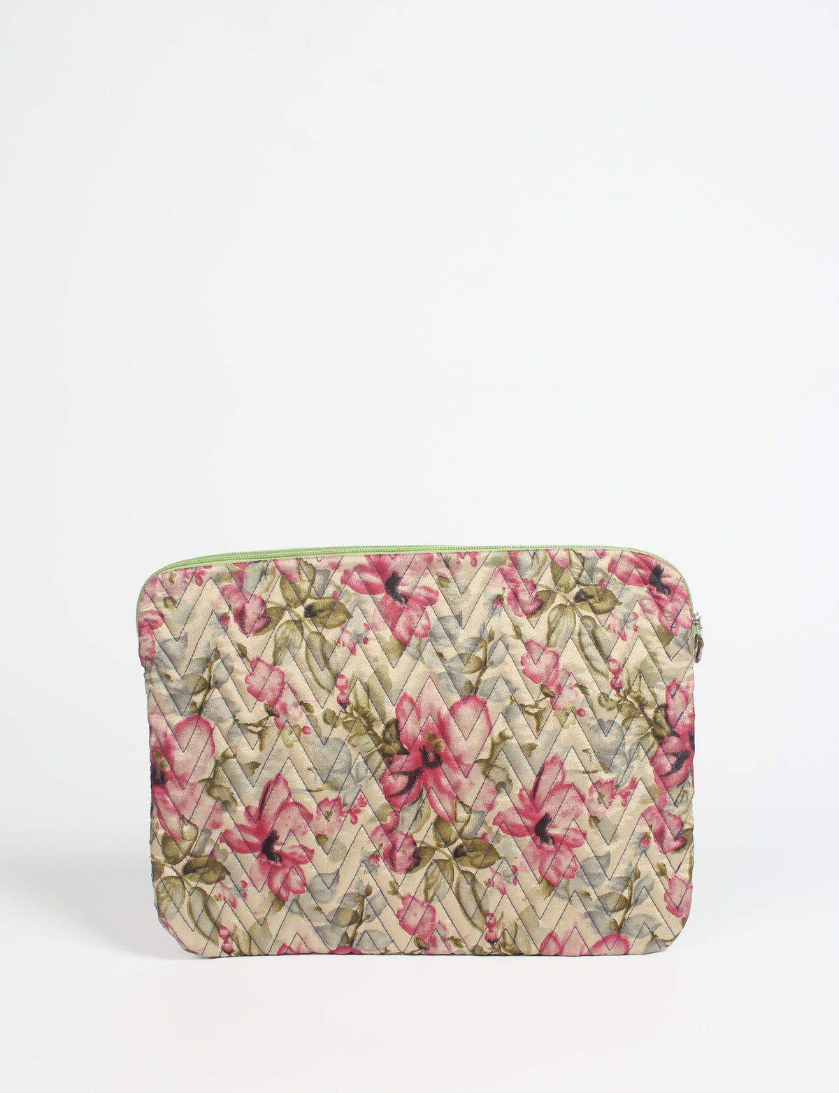 Quilted laptop sleeve with beige background, pink floral pattern, chevron stitching, and green zipper, front view