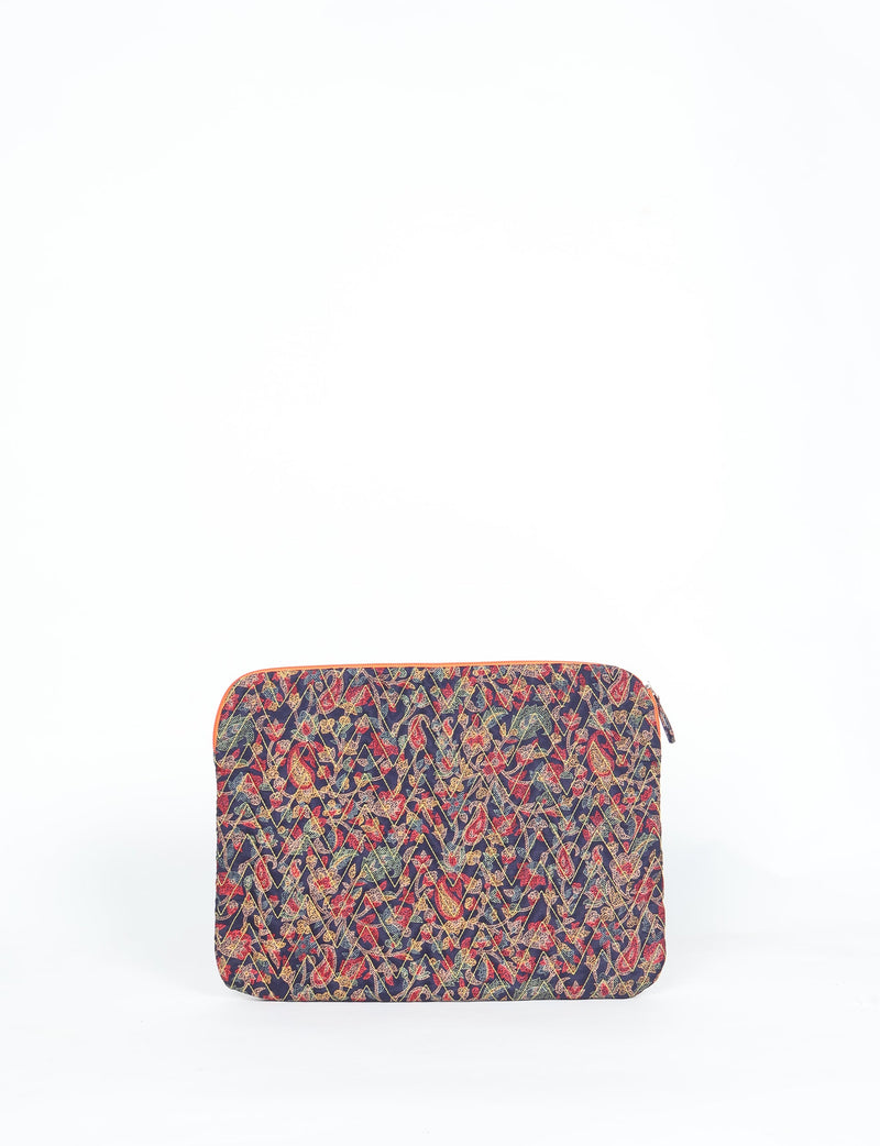 Quilted laptop sleeve with blue tropical pattern, multicolor leaves and flowers, front view, zipper closure on top edge