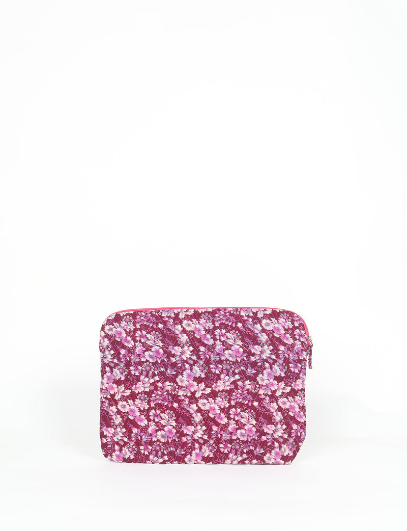 Quilted laptop sleeve with pink floral pattern on burgundy background, front view, zipper closure visible at top edge