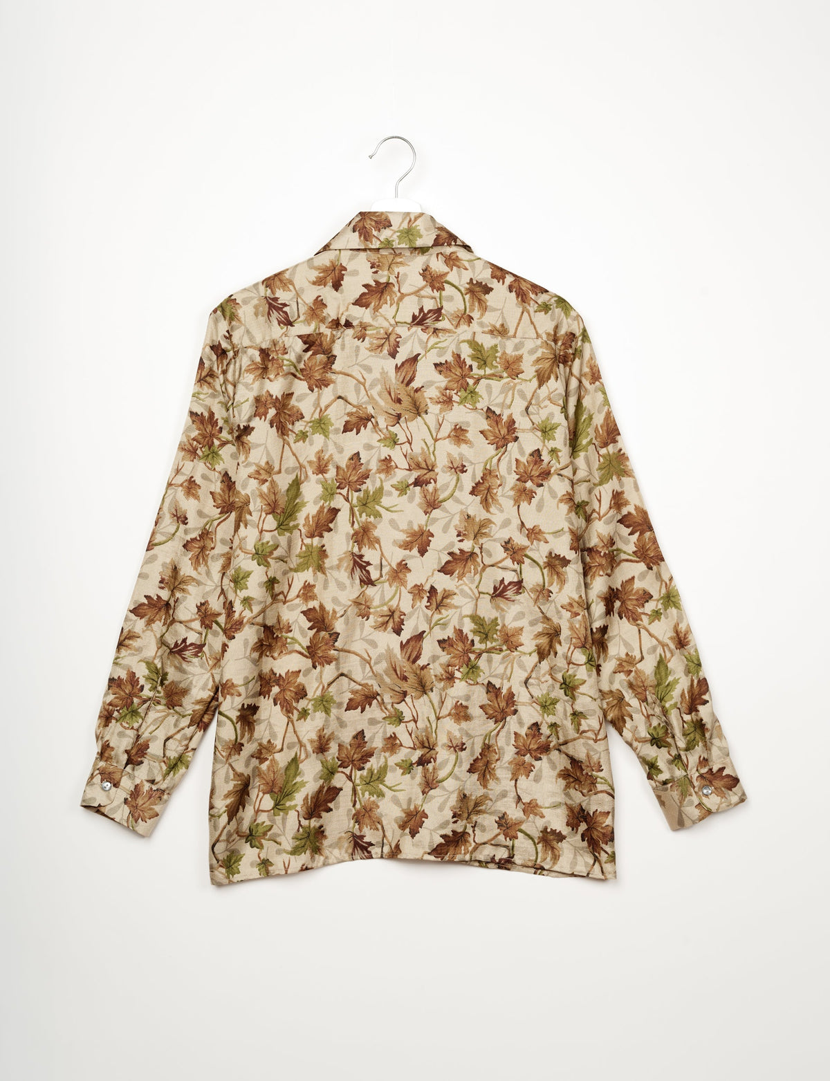 A person wearing a Resort Shirt, a sustainable fashion choice made from recycled materials.