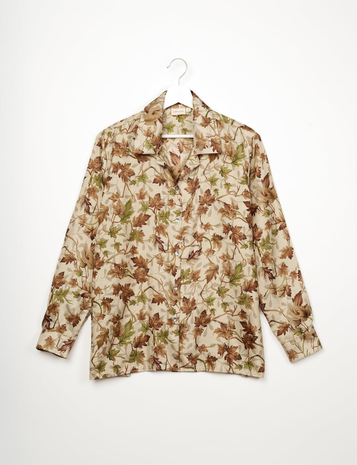 A person wearing a Resort Shirt, a sustainable fashion choice made from recycled materials.