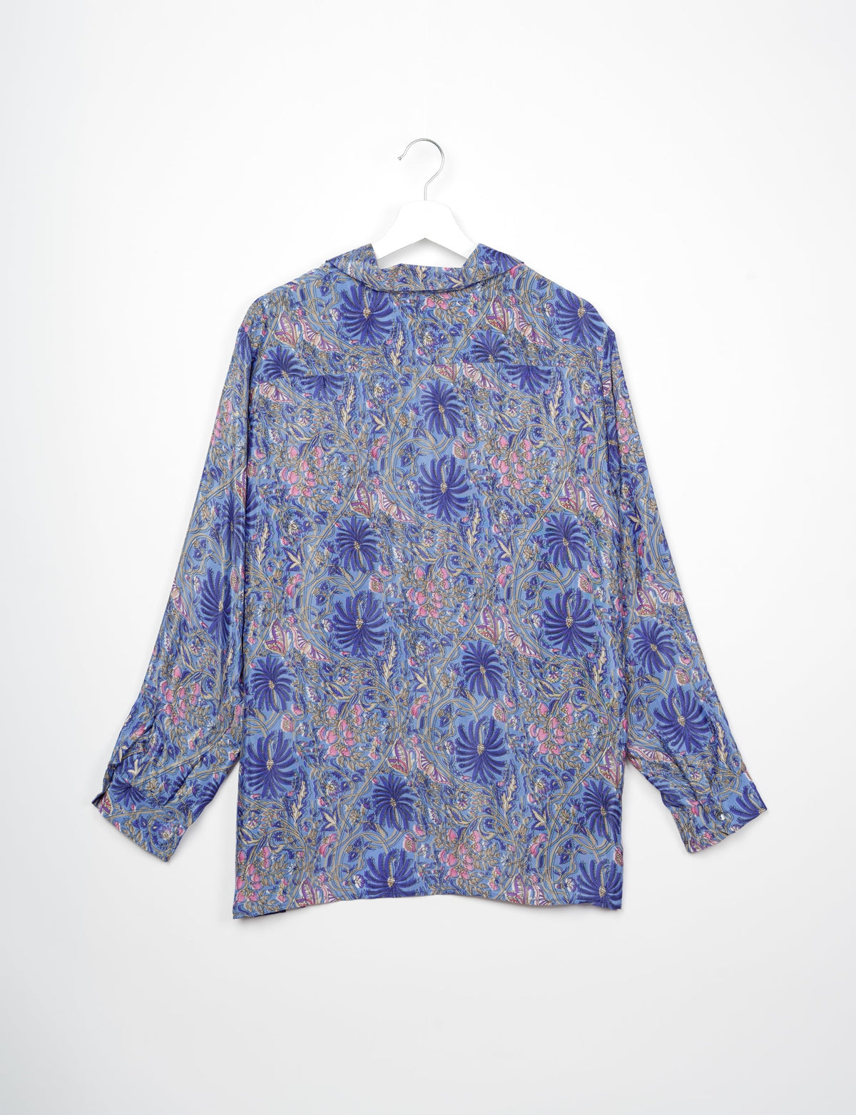 A person wearing a Resort Shirt, a sustainable fashion choice made from recycled materials.