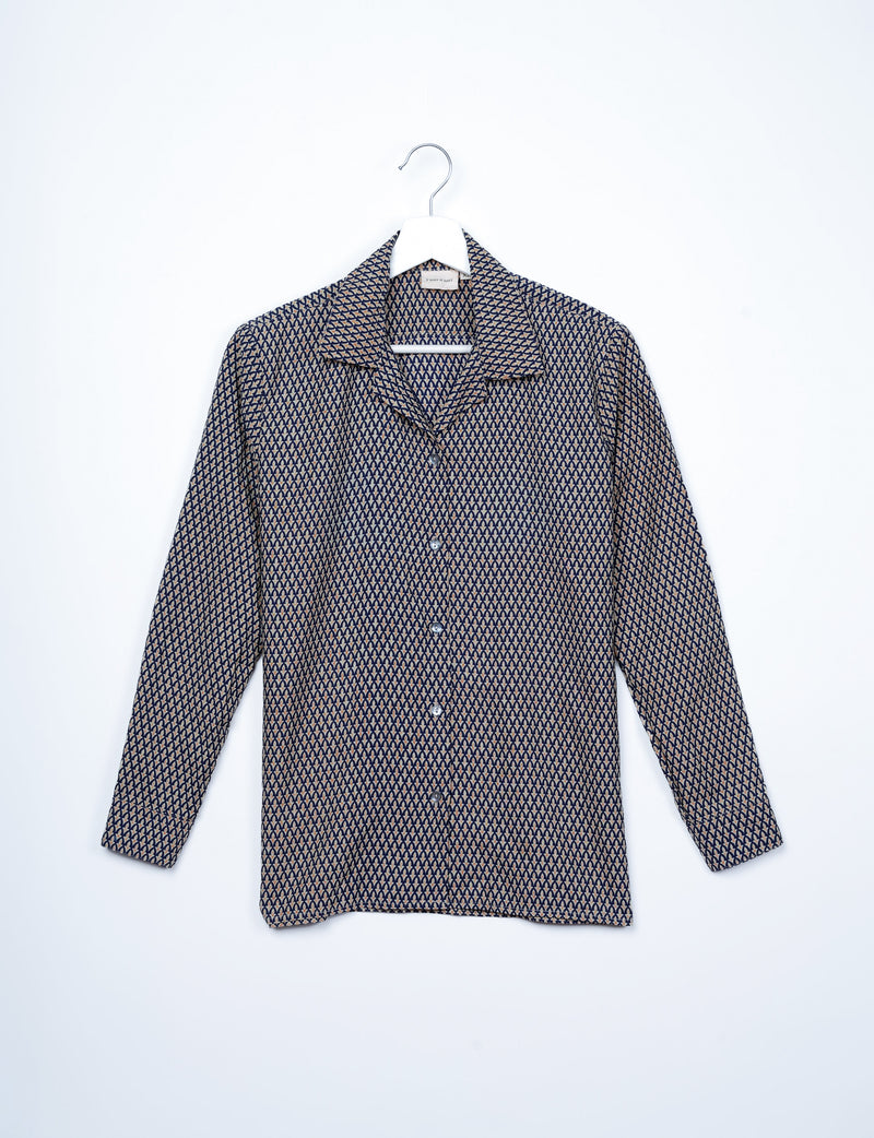 Long-sleeve button-up resort shirt with black and beige micro geometric pattern, displayed on white hanger, front view