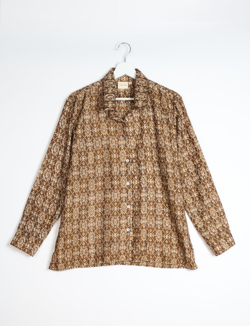 Beige and brown Indian ethnic patterned long-sleeve button-up resort shirt hanging on white hanger front view