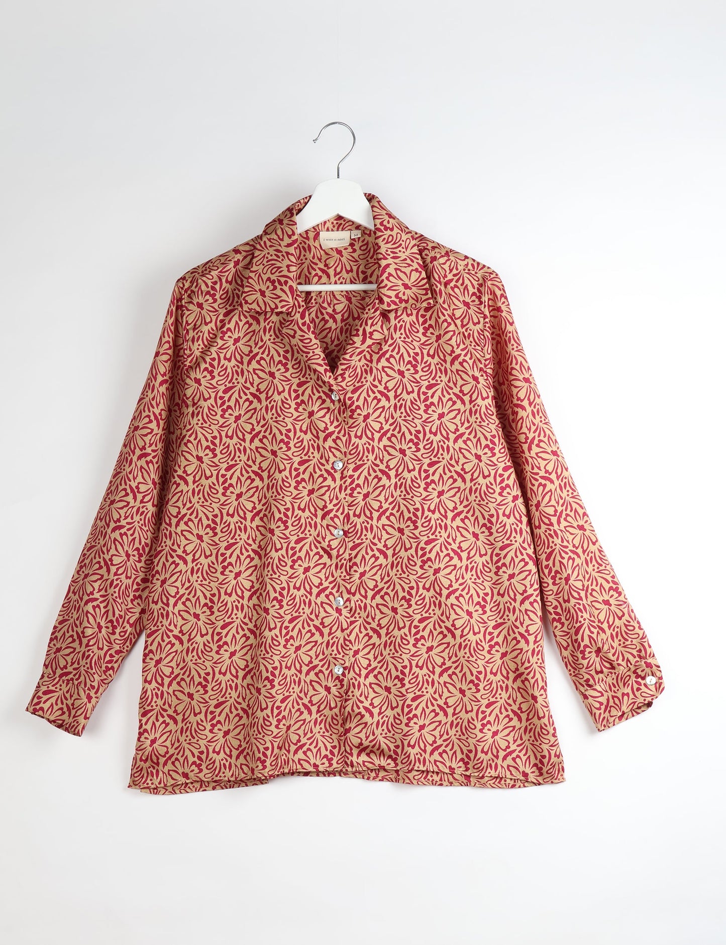 A person wearing a Resort Shirt, a sustainable fashion choice made from recycled materials.