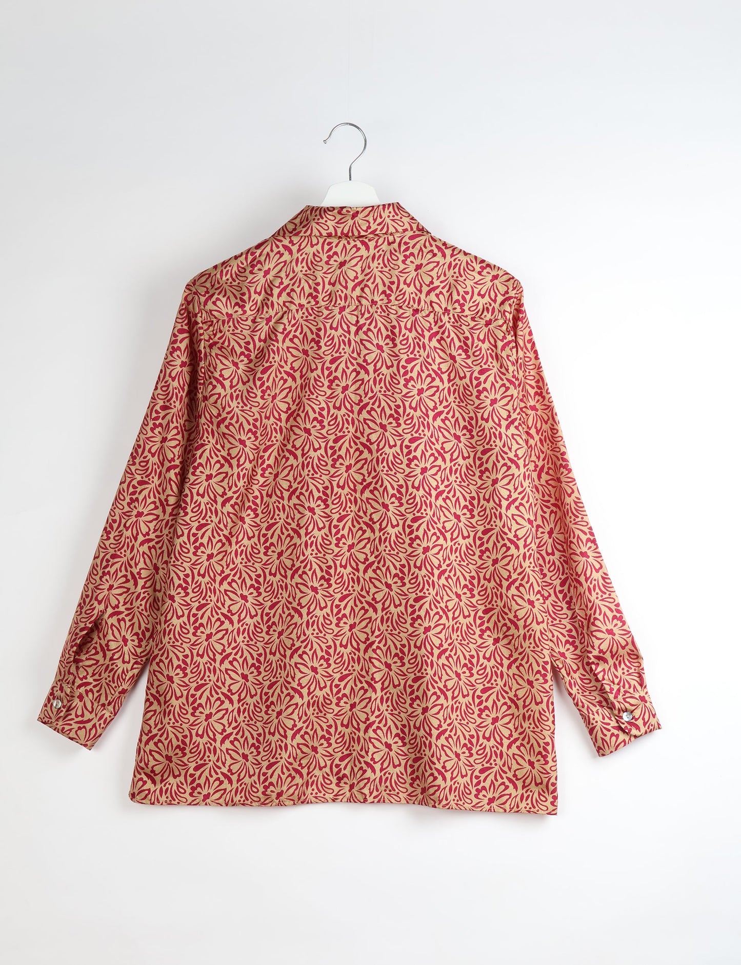 A person wearing a Resort Shirt, a sustainable fashion choice made from recycled materials.