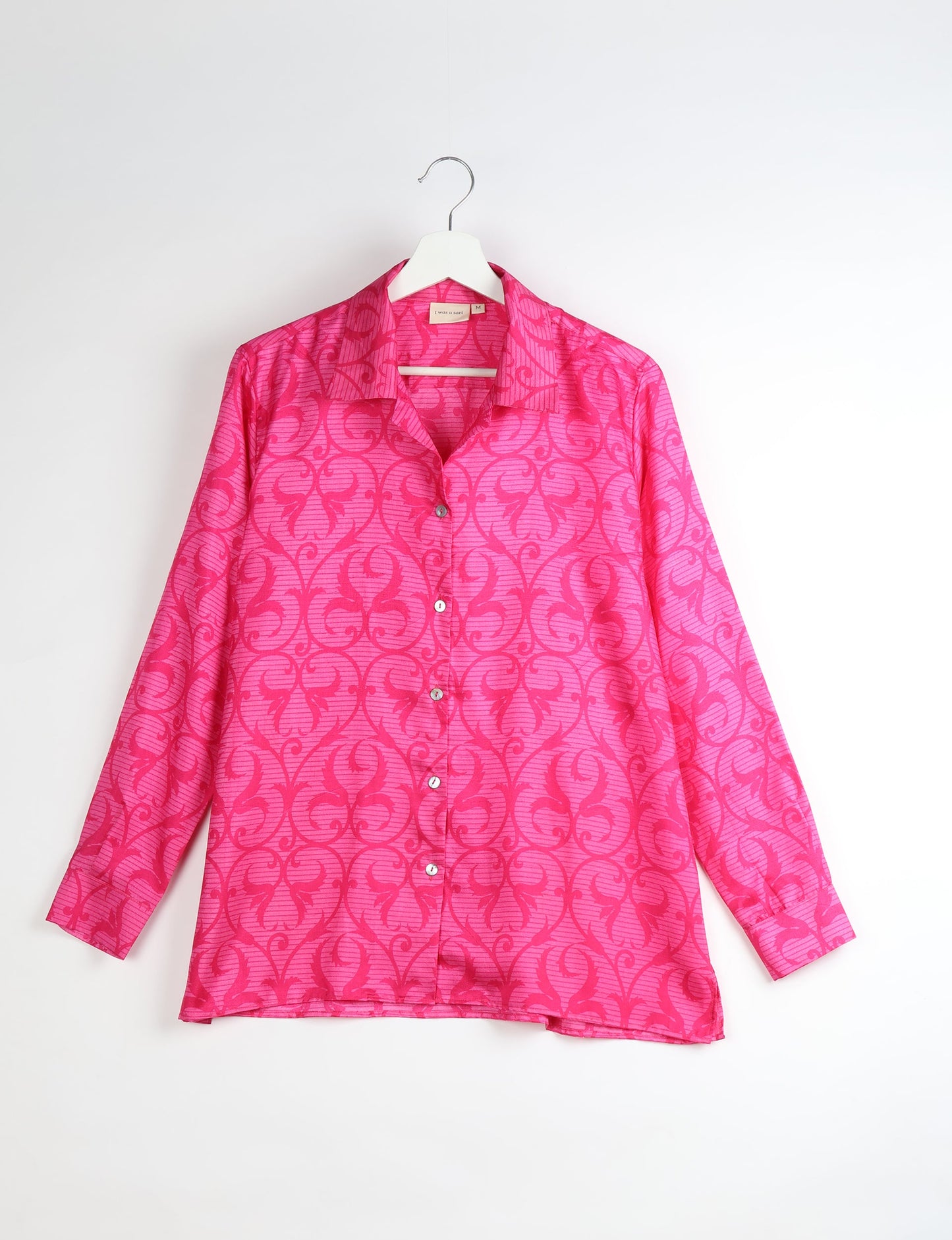 A person wearing a Resort Shirt, a sustainable fashion choice made from recycled materials.