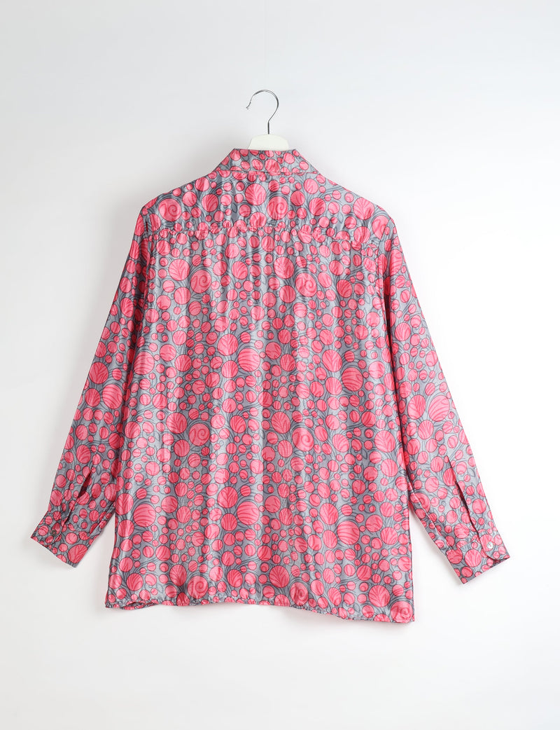 Long-sleeve resort shirt with pink circular leaf patterns on gray fabric, shown from back on white hanger against white background