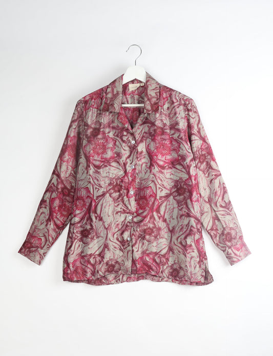 A person wearing a Resort Shirt, a sustainable fashion choice made from recycled materials.