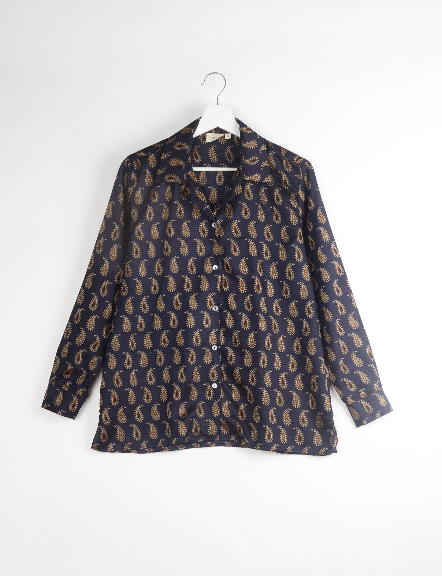 A person wearing a Resort Shirt, a sustainable fashion choice made from recycled materials.