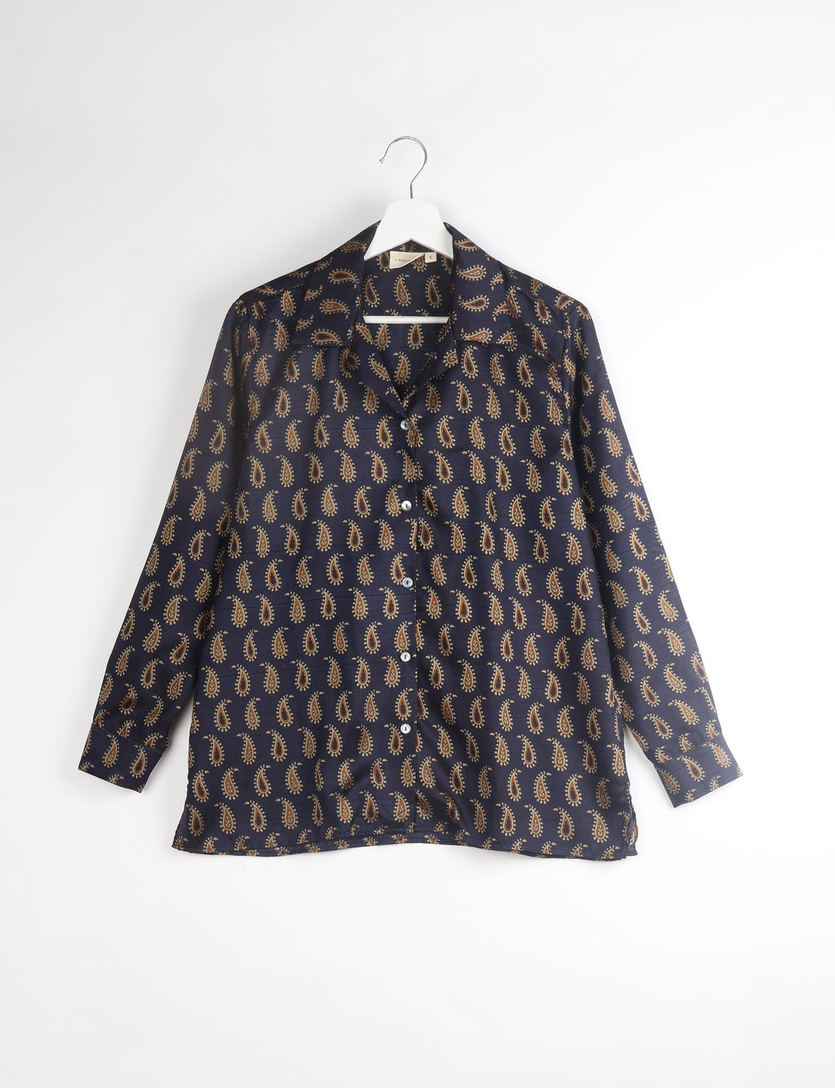 A person wearing a Resort Shirt, a sustainable fashion choice made from recycled materials.