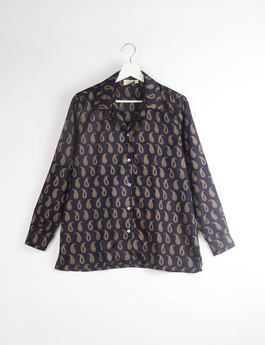 A person wearing a Resort Shirt, a sustainable fashion choice made from recycled materials.