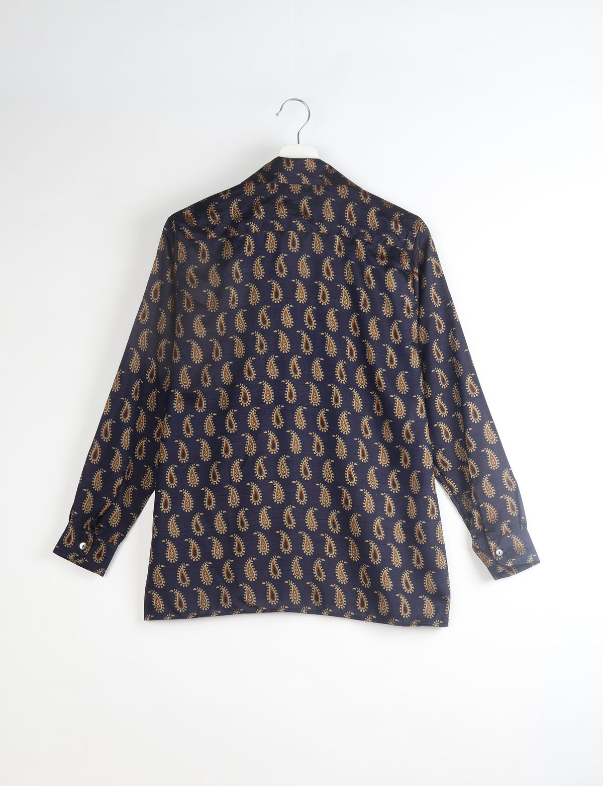 A person wearing a Resort Shirt, a sustainable fashion choice made from recycled materials.