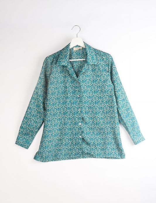 A person wearing a Resort Shirt, a sustainable fashion choice made from recycled materials.