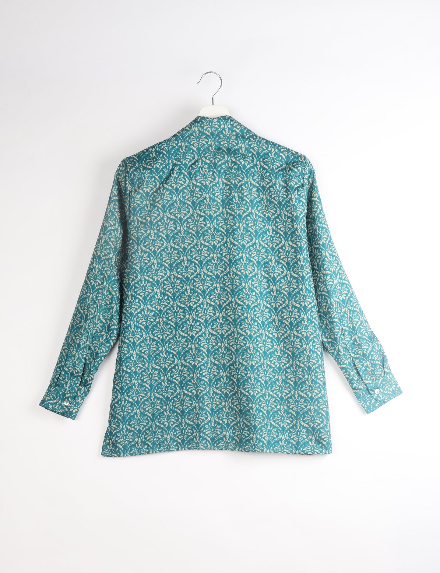 A person wearing a Resort Shirt, a sustainable fashion choice made from recycled materials.