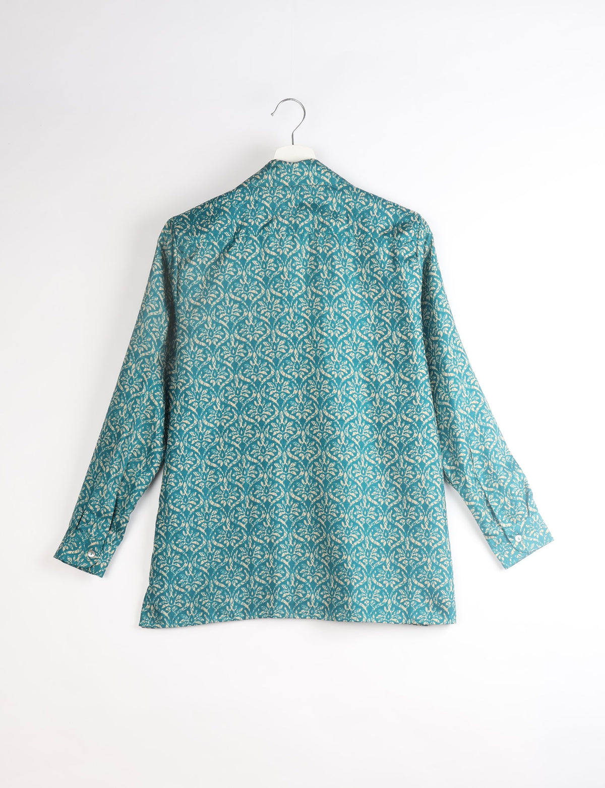 A person wearing a Resort Shirt, a sustainable fashion choice made from recycled materials.
