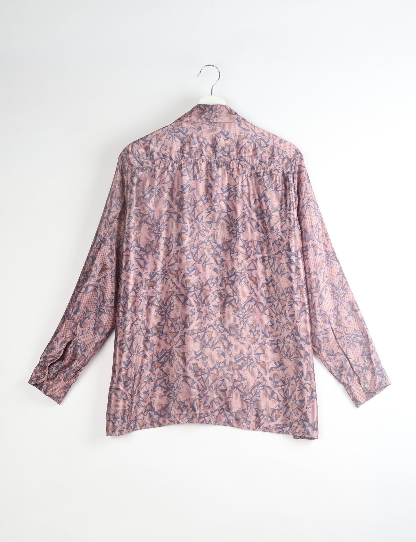 A person wearing a Resort Shirt, a sustainable fashion choice made from recycled materials.