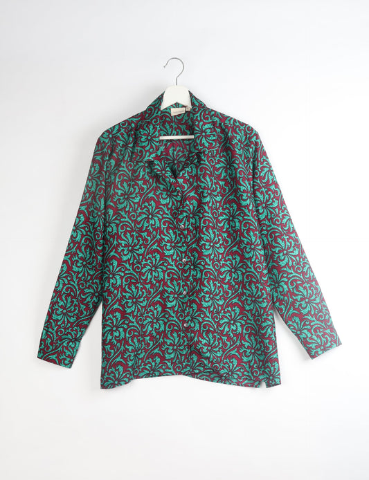 A person wearing a Resort Shirt, a sustainable fashion choice made from recycled materials.