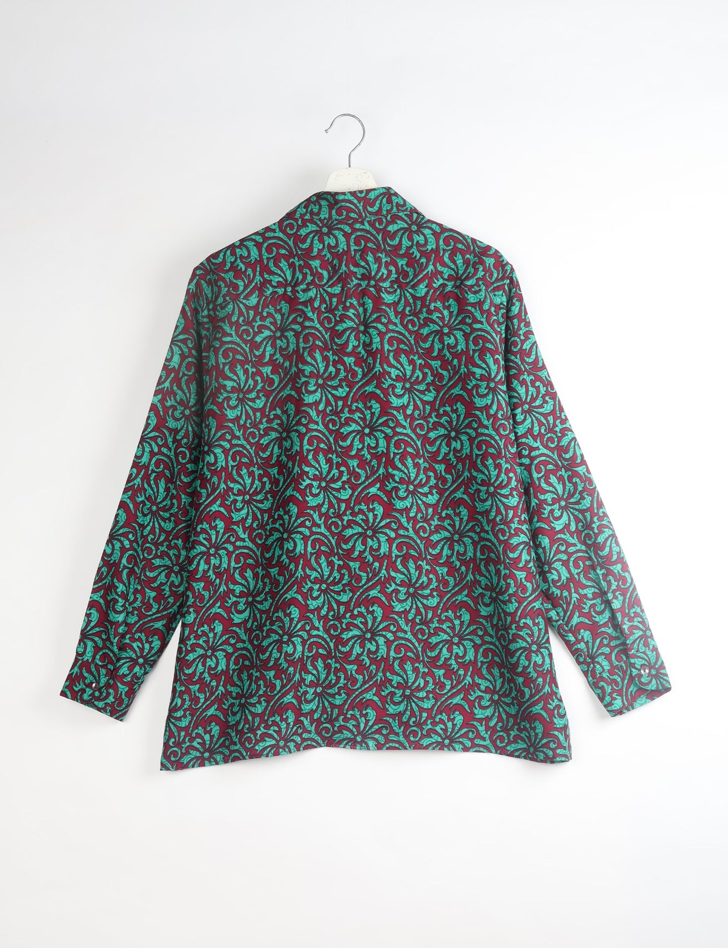 A person wearing a Resort Shirt, a sustainable fashion choice made from recycled materials.